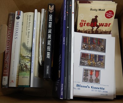 Lot 162 - A box of military related books, auction catalogues and DVD's to include