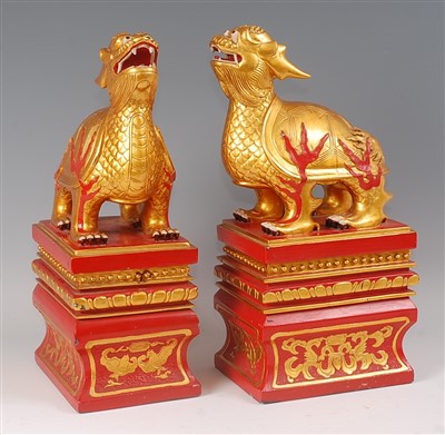 Lot 2359 - A decorative pair of Chinese gilt and red...