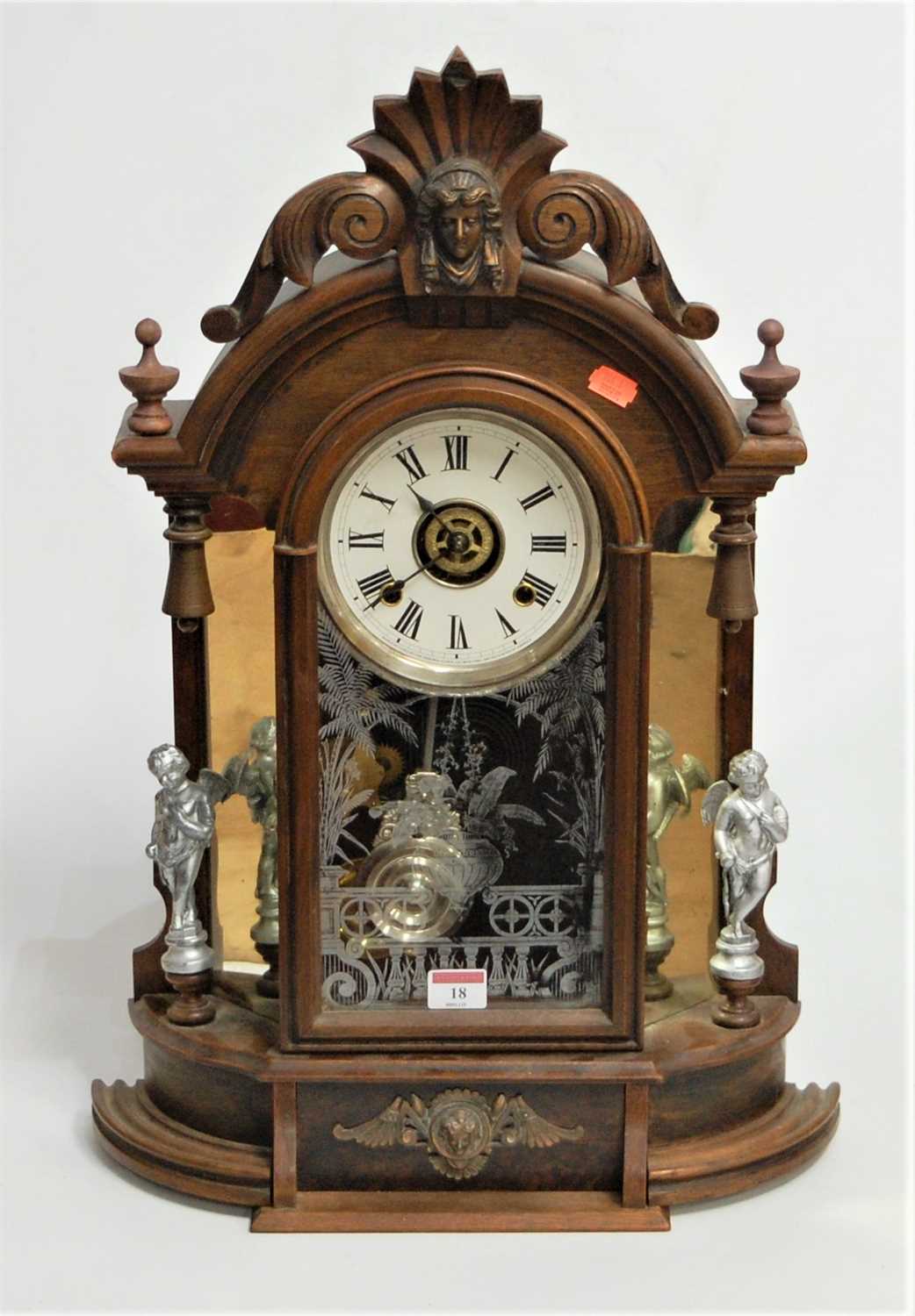 Lot 18 - A late 19th century walnut cased mantel clock,...