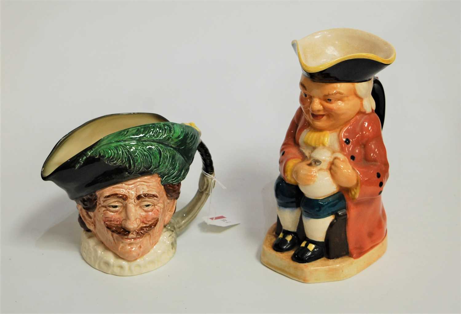 Lot 19 - A Burlington ware Toby jug, in typical seated...
