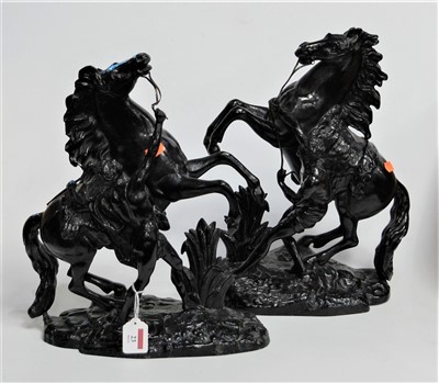 Lot 23 - After Moreau - a pair of black painted spelter...