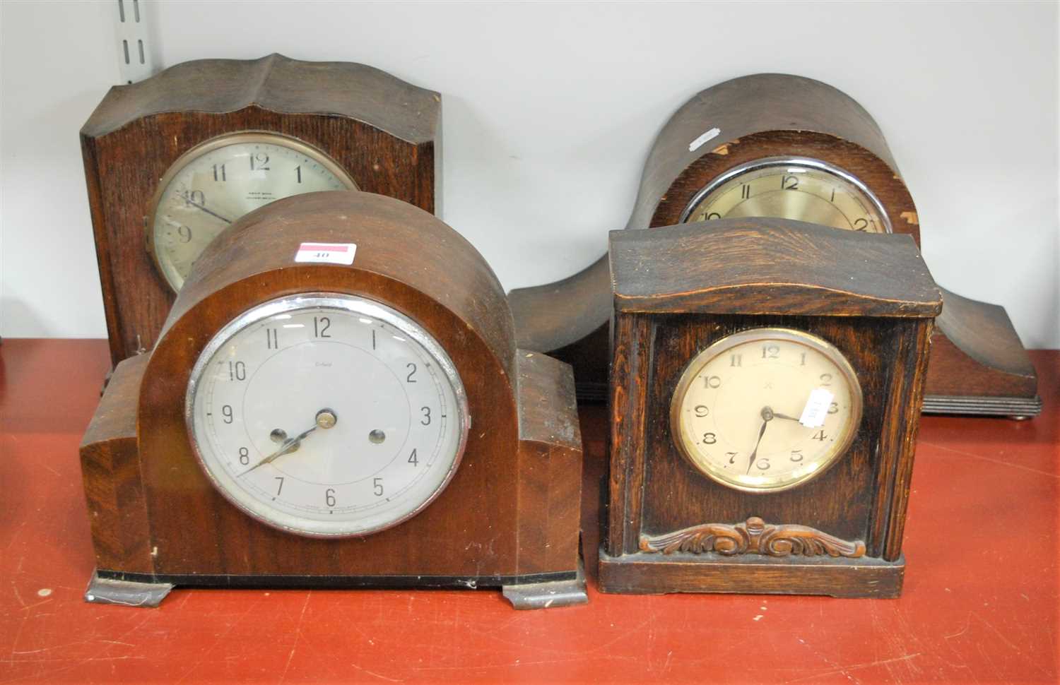 Lot 40 - A 1950s Enfield oak cased mantel clock, having...