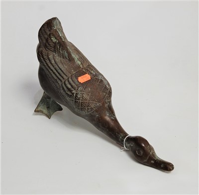 Lot 45 - A modern bronzed figure of a duck, length 37cm