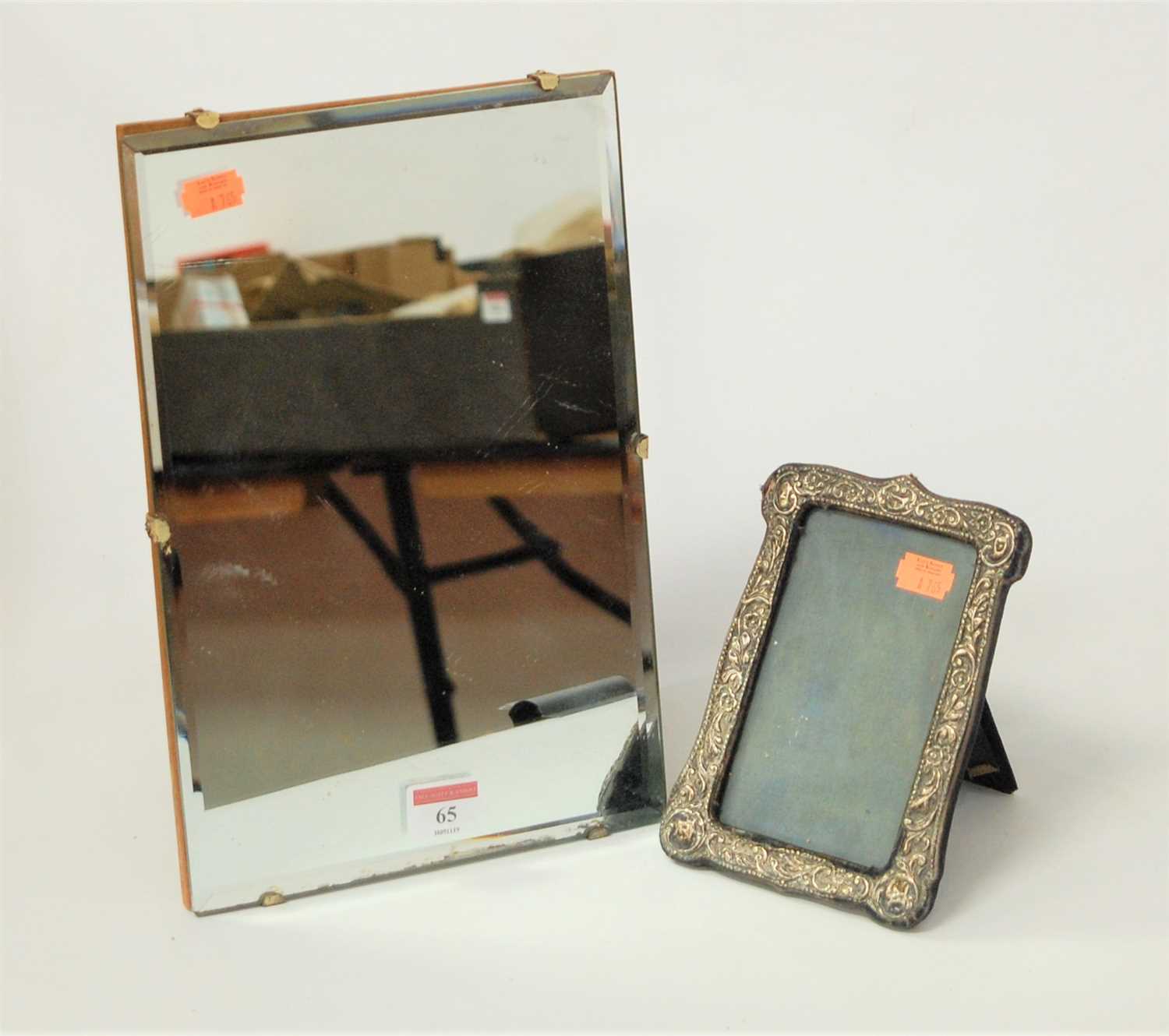 Lot 65 - A silver clad easel photograph frame, in the...