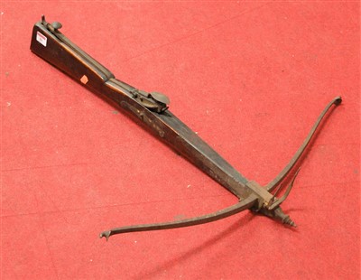 Lot 86 - A reproduction walnut and iron mounted crossbow
