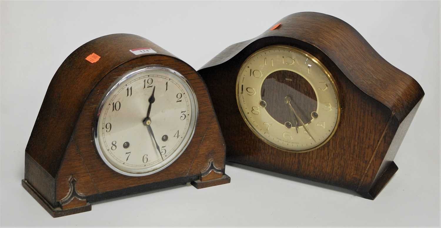 Lot 114 - A 1950s oak cased mantel clock having a...