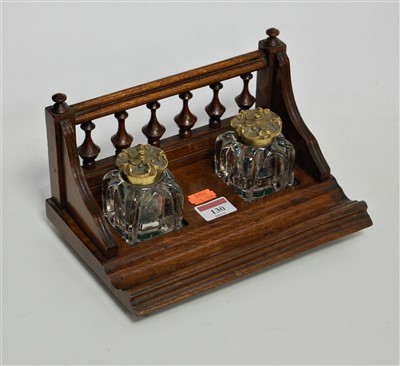 Lot 130 - A late Victorian oak desk stand having a...