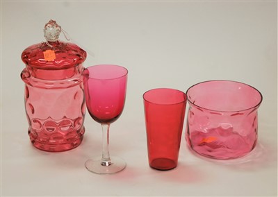 Lot 146 - A cranberry glass jar and cover together with...