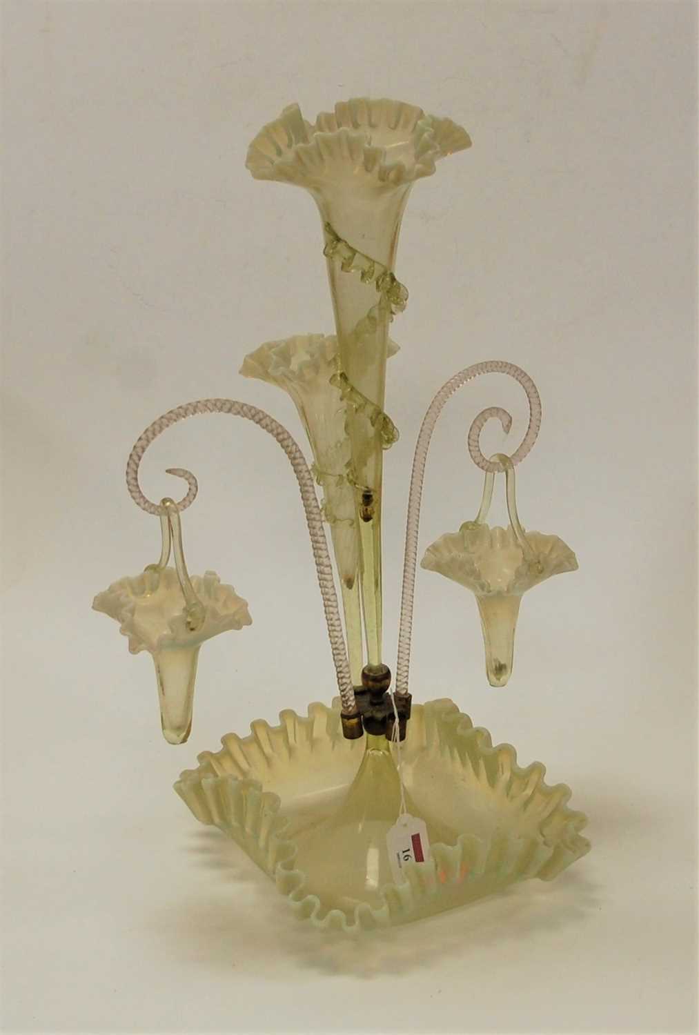 Lot 161 - A Victorian three trumpet vaseline glass table...