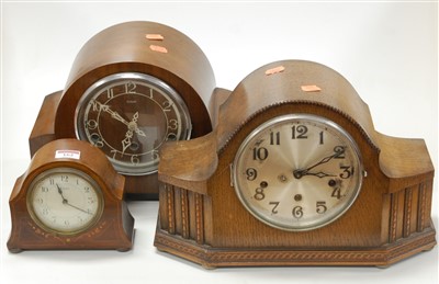 Lot 162 - A 1930s oak mantel clock having a silvered...