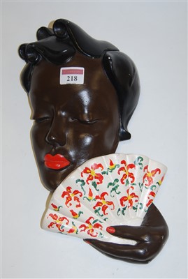 Lot 218 - A West German pottery wall mask of a lady in...