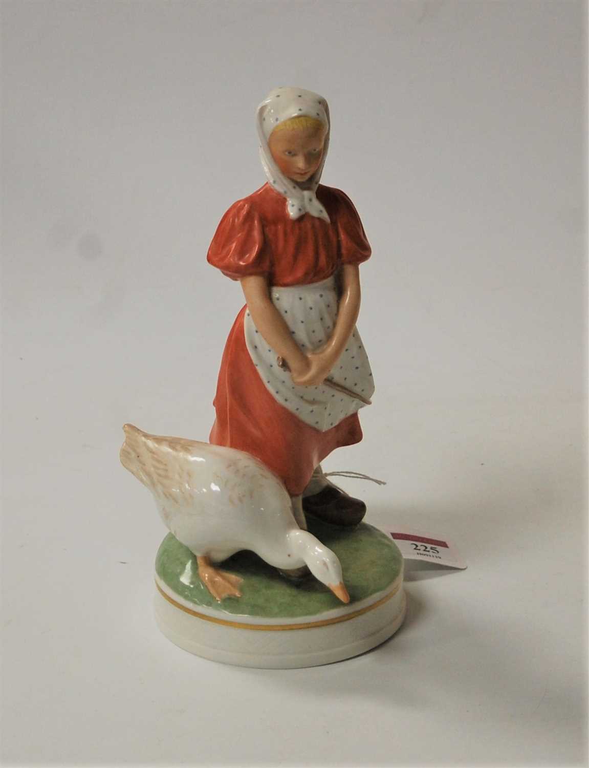 Lot 225 - A Royal Copenhagen porcelain figure of a young...