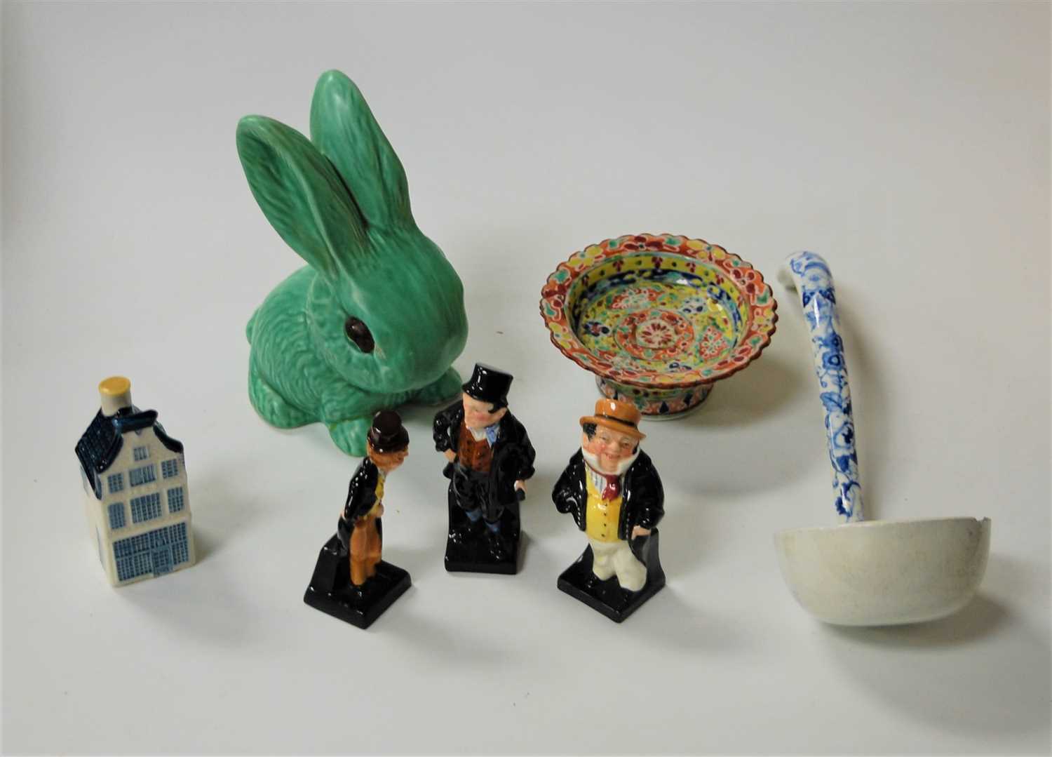 Lot 254 - Three Royal Doulton Dickens figures, to...