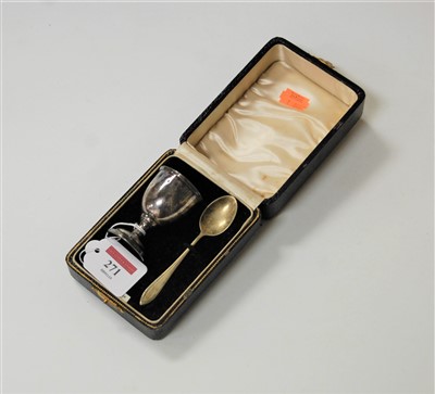 Lot 271 - A sterling silver egg cup with spoon, in...