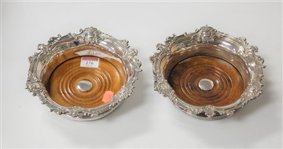 Lot 276 - A pair of silver plated bottle coasters, in...