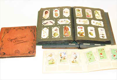 Lot 773 - A cigarette card album and contents, to...