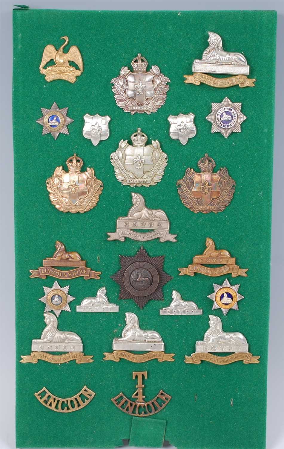 Lot 105 - A collection of cap badges, collar badges and shoulder titles