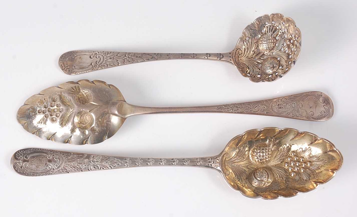 Lot 2098 - A George III silver berry spoon and one other...