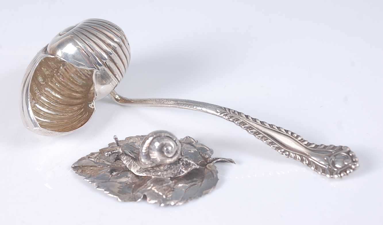 Lot 2108 - A continental 800 silver caddy spoon, the bowl...