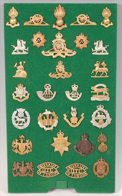 Lot 111 - A collection of British Army cap badges and insignia