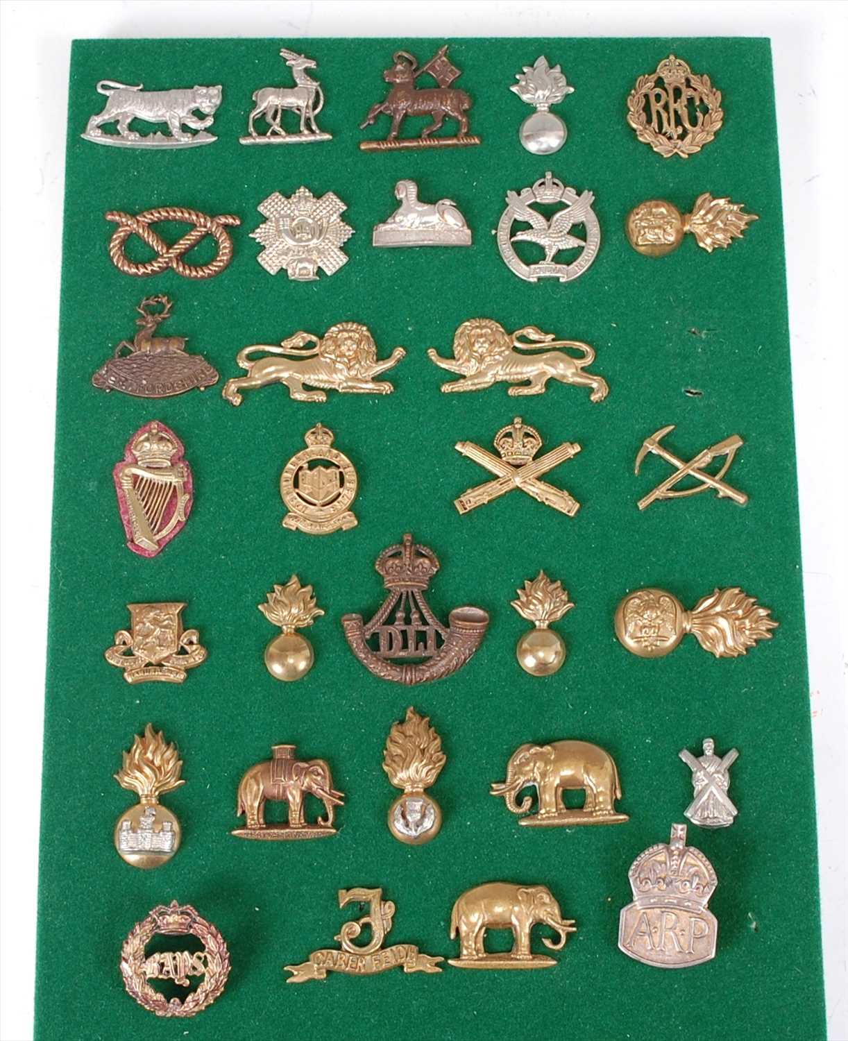 Lot 112 - A collection of British Army badges and insignia