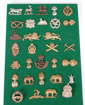 Lot 112 - A collection of British Army badges and insignia