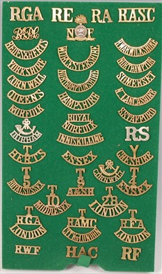 Lot 114 - A collection of British Army brass shoulder titles to include
