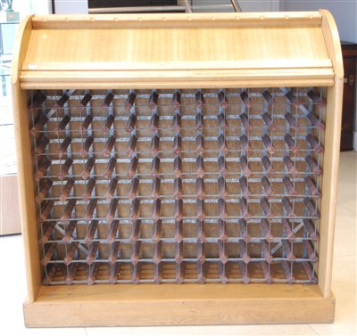 Lot 1418 - A contemporary oak wine rack, having space for...