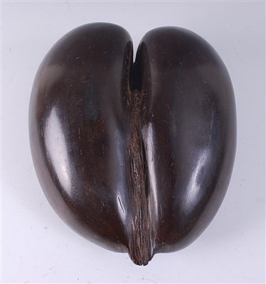 Lot 2254 - A coco de mer nut pod, cut away and carved to...