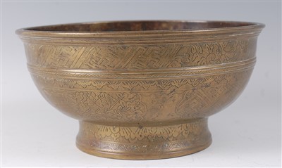Lot 2355 - A 19th century Tibetan bronze bowl, engraved...