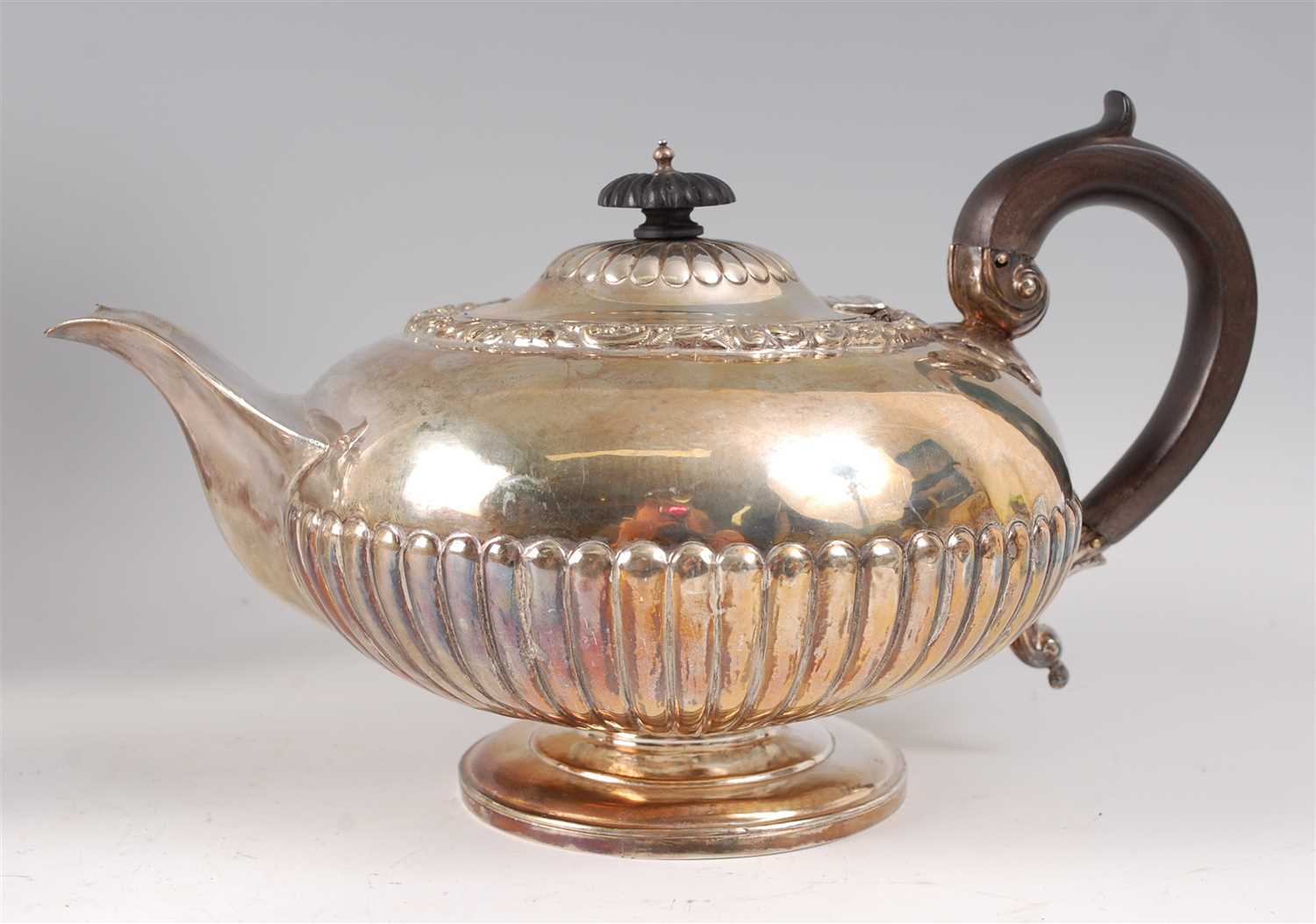 Lot 2117 - A William IV silver teapot, of half-reeded...