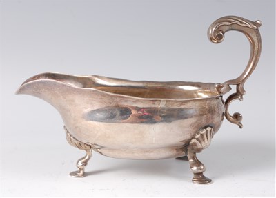 Lot 2107 - A George II silver sauceboat, having acanthus...