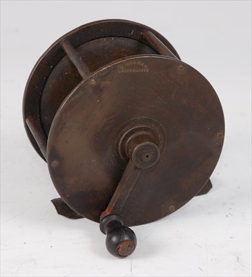 Lot 524 - A circa 1900 brass 3 1/4" brass centre pin reel