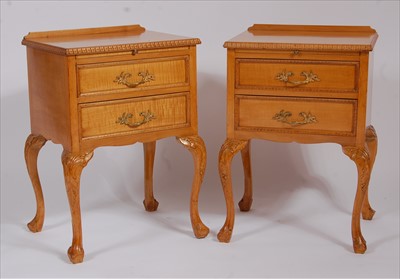 Lot 2568 - A pair of 1920s satin birch two drawer bedside...