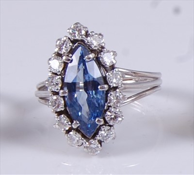 Lot 2198 - A white metal, sapphire and diamond marquise...