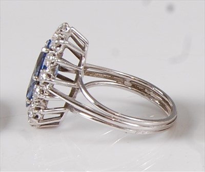 Lot 2198 - A white metal, sapphire and diamond marquise...