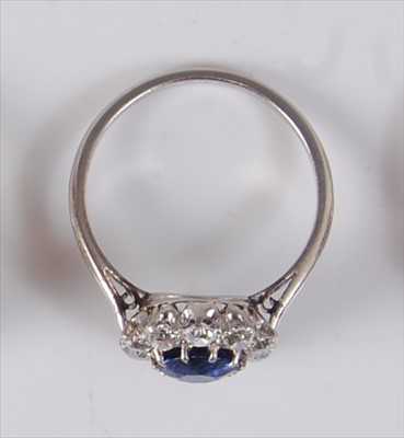 Lot 2200 - A white metal, sapphire and diamond circular...