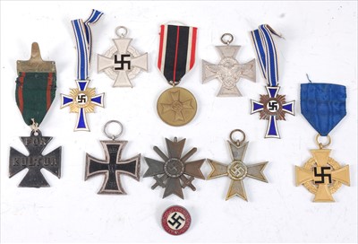 Lot 407 - A collection of German medals and badges to include
