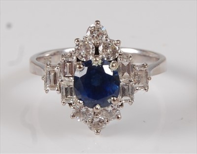 Lot 2218 - A white metal, sapphire and diamond marquise...