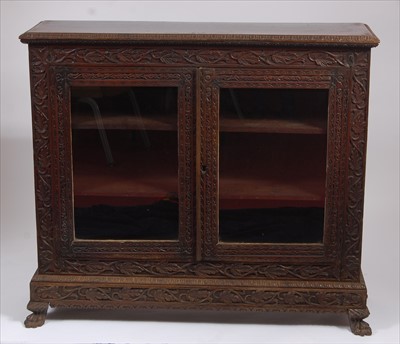 Lot 2515 - A circa 1900 Burmese heavily carved 'rosewood'...