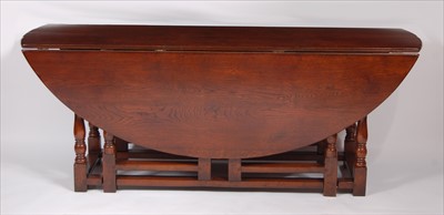 Lot 2572 - A 17th century style joined oak double gateleg...