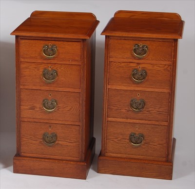 Lot 2502 - A pair of oak ledgeback bedside chests, each...