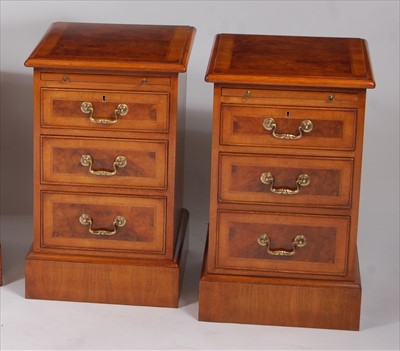 Lot 2504 - A pair of figured walnut cross and feather...