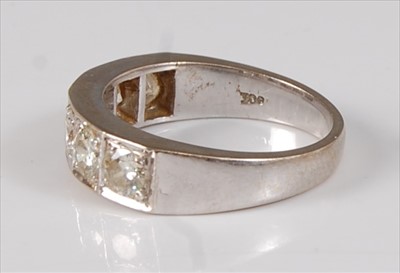 Lot 2183 - A white metal diamond half hoop eternity ring,...