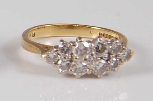 Lot 2185 - An 18ct yellow and white gold diamond marquise...
