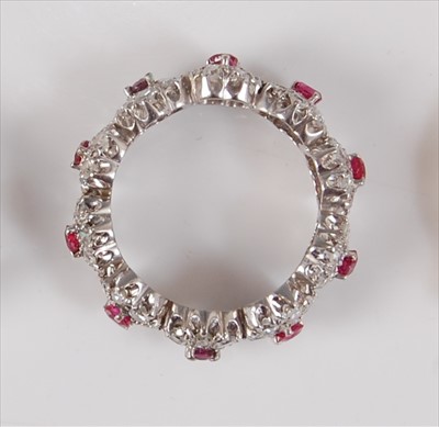 Lot 2184 - A white metal, ruby and diamond circular...