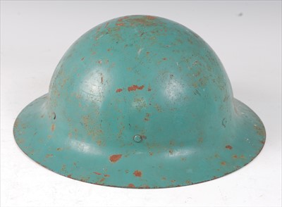 Lot 432 - A Brodie pattern blue painted steel helmet