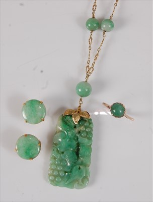 Lot 2193 - A Chinese carved spinach jade pendant, in...