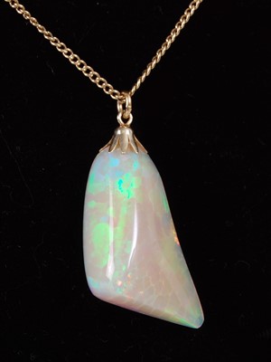 Lot 2222 - A polished opal pendant, weighing approx 25...