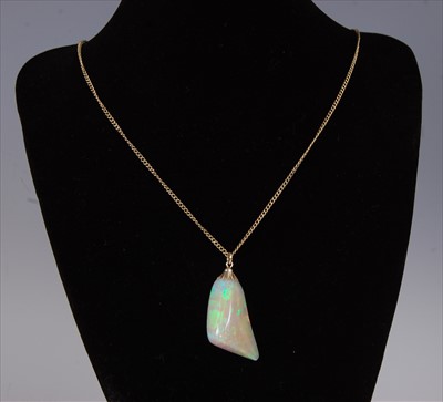 Lot 2222 - A polished opal pendant, weighing approx 25...